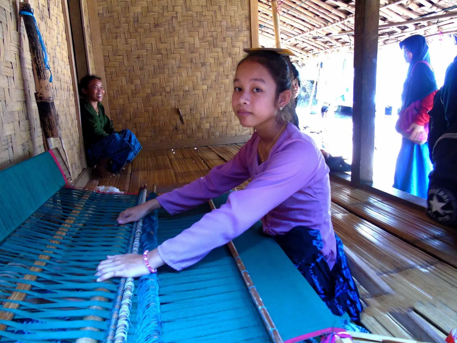 Baduy woman making traditional cloth in Baduy Luar village