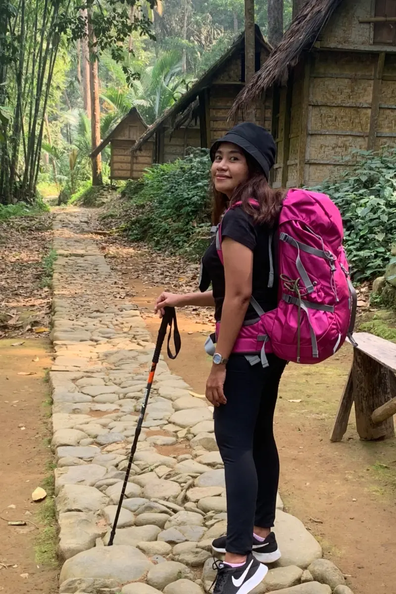 Private trip guests posing in front of a traditional Baduy rice barn